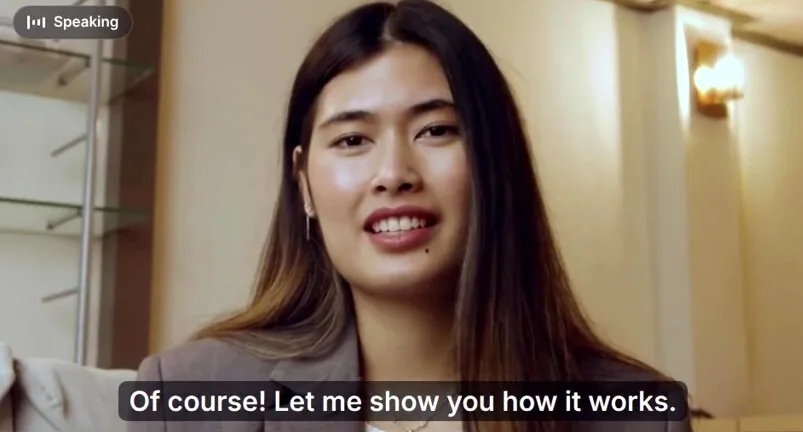 A smiling agent speaking on a video call with live captions on screen
